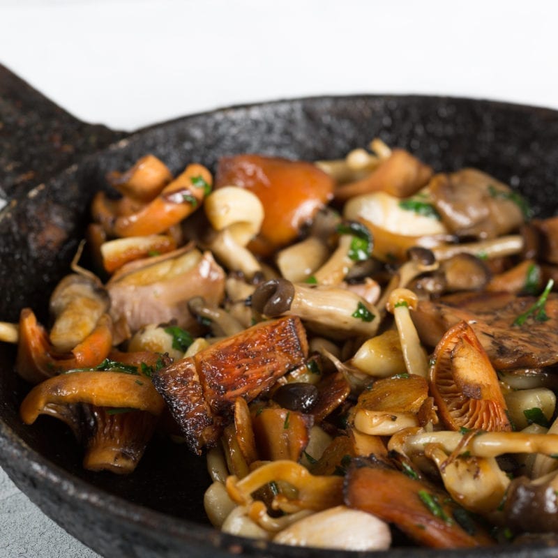 Sauteed Garlic and Mushrooms in pan.