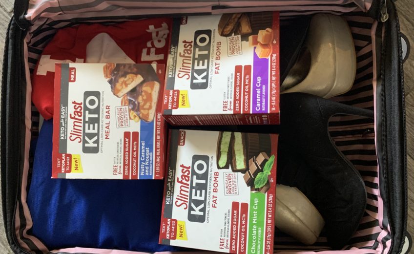 Hazely's suitcase full of SlimFast Keto Bars and Fat Bombs