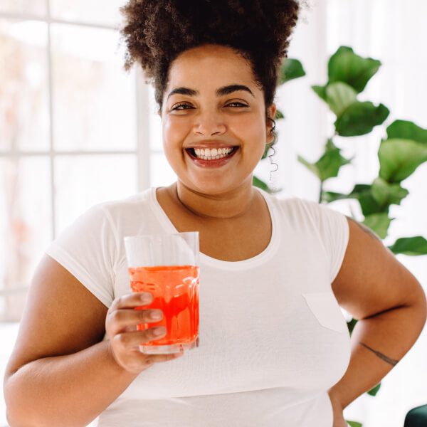 Smiling woman holding drink