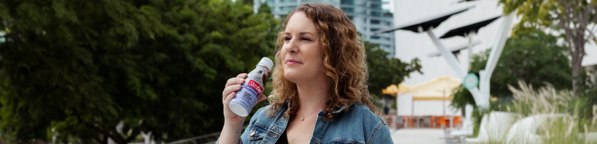 Woman holding SlimFast High Protein Drink