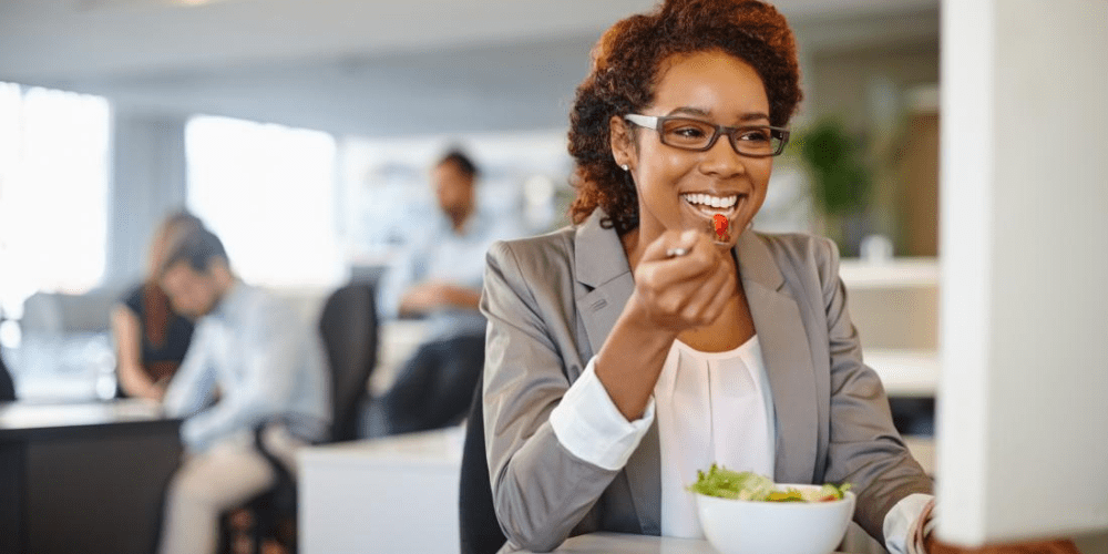 woman eating salad