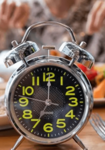 food with clock on table